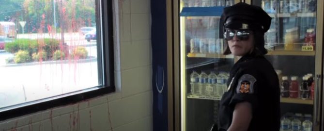 Heather Hall as Officer Mary in convenience store