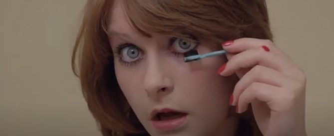 Tricia Walsh as Viv applying mascara